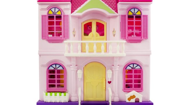 Pink dollhouse on a while background.