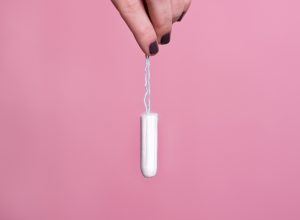 Woman's hand holding a tampon