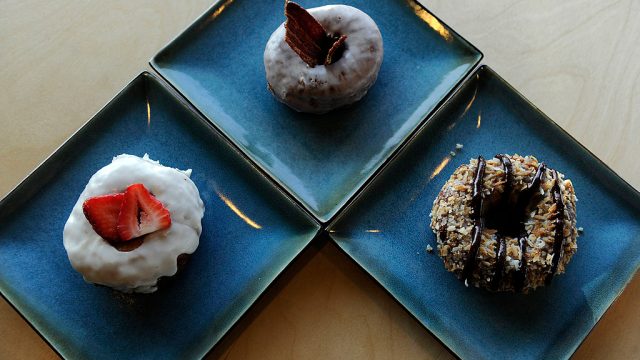 gourmet donuts on blue plates