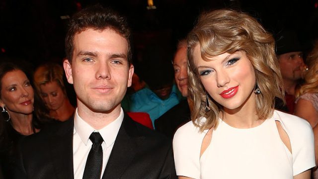 Austin and Taylor Swift sit side by side at the Annual Academy of Country Music Awards