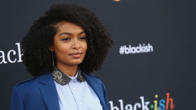Yara Shahidi wears a blue top on the red carpet.