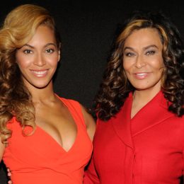 Beyonce and her mother Tina Knowles-Lawson, both wearing red