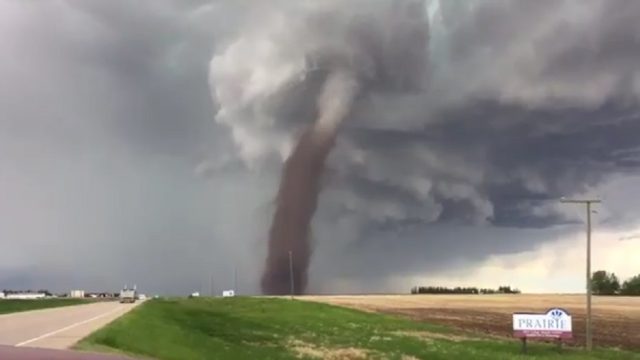 canada man mows lawn during tornado
