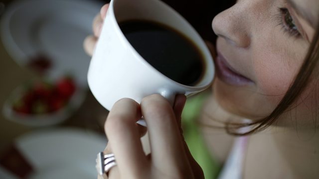 Image of woman drinking coffee