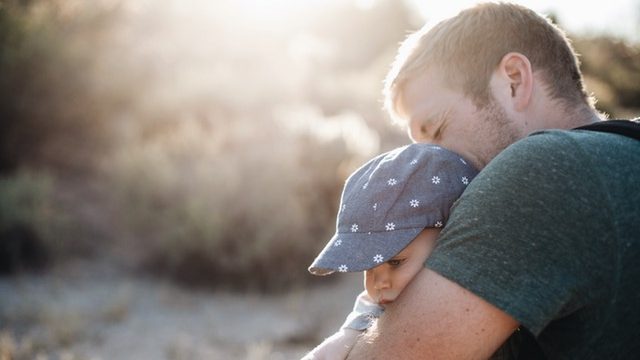 Father holds his baby