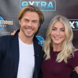 Derek Hough and Julianne Hough pose on the red carpet