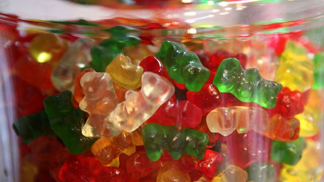 gummi bears in a glass jar at a candy store