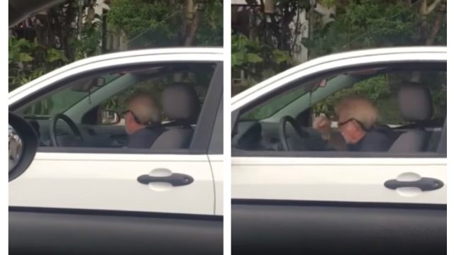man rocks out to metallica in car