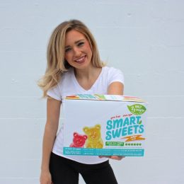 Tara Bosch holding a box of SmartSweets