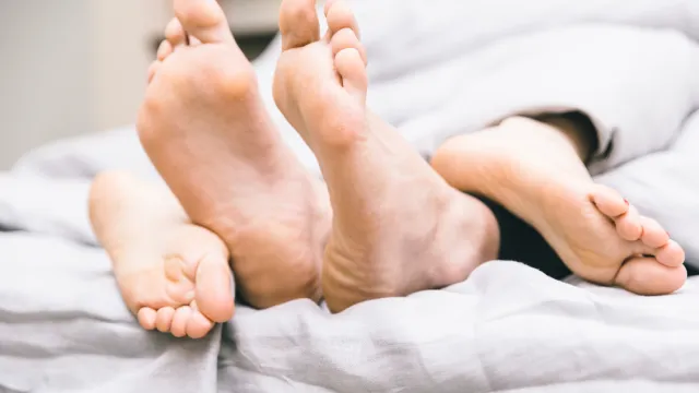 Couple in bed.