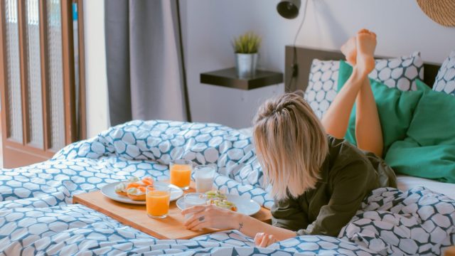 girl having breakfast in bed