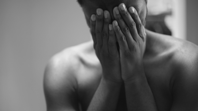 Woman with face in her hands