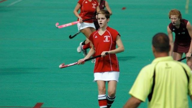 Emma Watson playing field hockey