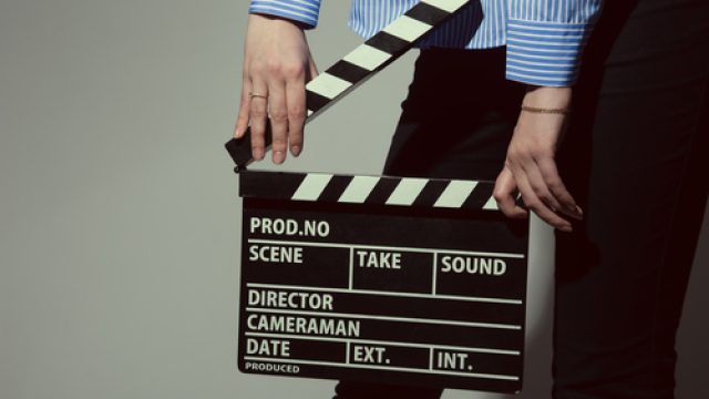 Woman with director slate