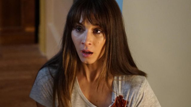 Trojan Bellisario as Spencer Hastings in Pretty Little Liars gasps while covered in a spot of blood