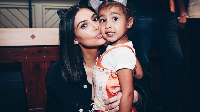 Kim Kardashian West and North West attend the Ariana Grande Dangerous Woman show at the Forum on March 31, 2017 in Inglewood, California.