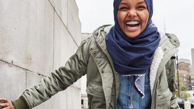 An American Eagle ad featuring model Halima Aden in a denim hijab