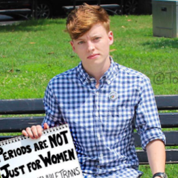 Picture of man bleeding holding a sign saying "periods are not just for women"