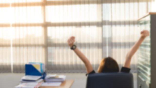 Woman stretching at desk