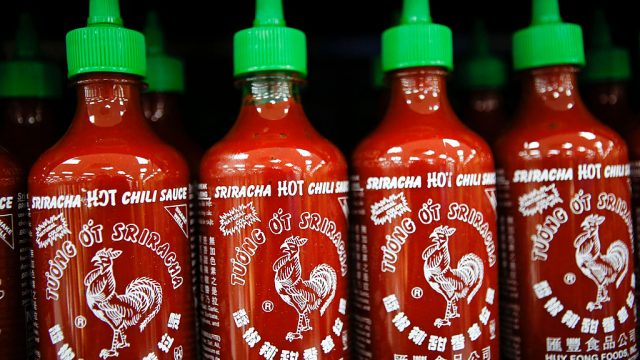 Four bottles of Sriracha