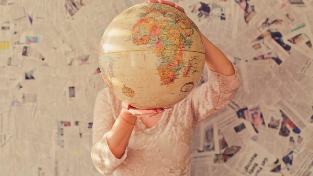 woman-holding-globe