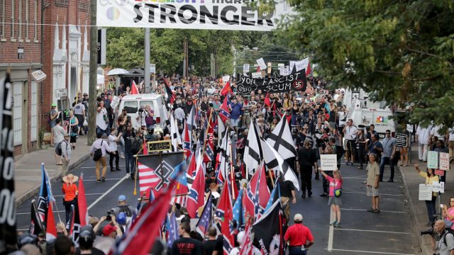 CHARLOTTESVILLE, VA - AUGUST 12: Hundreds of white nationalists, neo-Nazis and members of the "alt-right" march down East Market Street toward Lee Park during the "Unite the Right" rally August 12, 2017 in Charlottesville, Virginia. After clashes with anti-fascist protesters and police the rally was declared an unlawful gathering and people were forced out of Lee Park, where a statue of Confederate General Robert E. Lee is slated to be removed. (Photo by Chip Somodevilla/Getty Images)