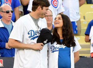 LOS ANGELES, CA - OCTOBER 19: Ashton Kutcher and wife Mila Kunis on the field after they announced the Los Angeles Dodgers starting lineup before game four of the National League Championship Series against the Chicago Cubs at Dodger Stadium on October 19, 2016 in Los Angeles, California.