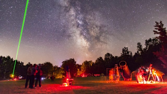 A scene at the Nova East Star Party near Windsor, Nova Scotia, in August 2015, showing laser pointer in use under a clear starry sky. (Photo by: Alan Dyer /VW PICS/UIG via Getty Images)