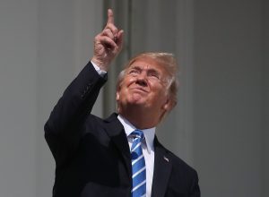 Image of Donald Trump looking at eclipse