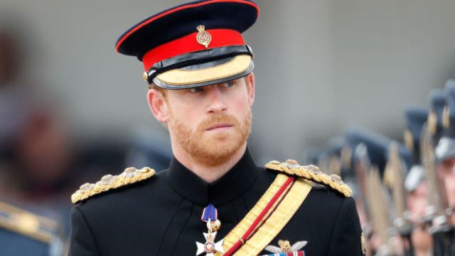 Prince Harry inspects a parade as he, on behalf of his grandmother Queen Elizabeth II