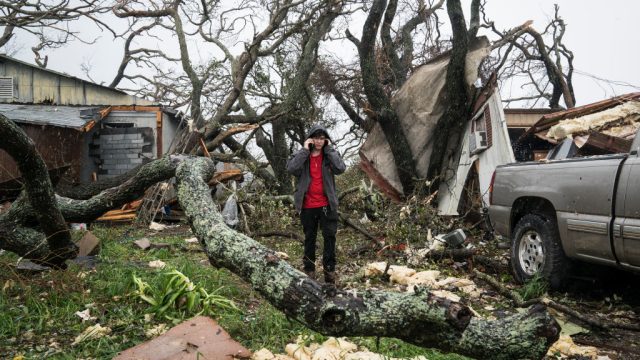 CITY-BY-The Sea, TX - AUGUST 26: People gather supplies out of destroyed homes to take back to a shelter near City-By-The Sea, TX as Hurricane Harvey hits the Texas coast on Saturday, Aug 26, 2017. (Photo by Jabin Botsford/The Washington Post via Getty Images)