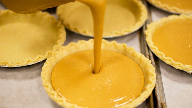 Pumpkin mix is poured into a pie crust, on one of the busiest days for pie making, two days before Thanksgiving, at Verrill Farm in Concord, Mass. on Tuesday, Nov. 24, 2009.