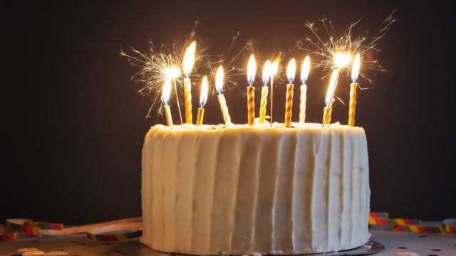 Birthday cake with candles and sparklers.