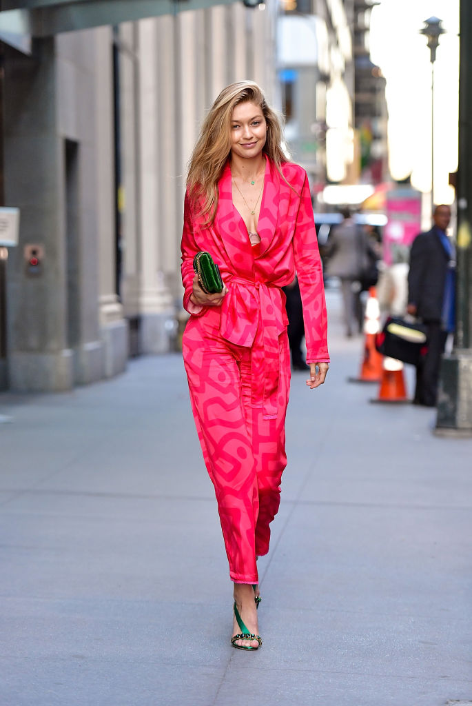 Gigi Hadid wore the hot pink pantsuit of our Barbie dreams, proving  millennial pink is so last season - HelloGigglesHelloGiggles