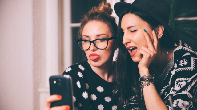 sticking tongue out selfie portrait