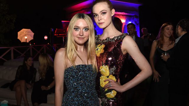 LOS ANGELES, CA - JUNE 14: Actresses Dakota Fanning (L) and Elle Fanning pose at the after party for the premiere of Amazon's "The Neon Demon" at the Hollywood Forever Cemetery on June 14, 2016 in Los Angeles, California.