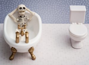 A skeleton relaxing in a bathtub