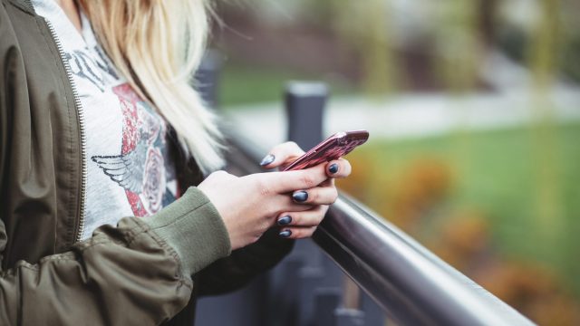 woman-holding-cell-phone