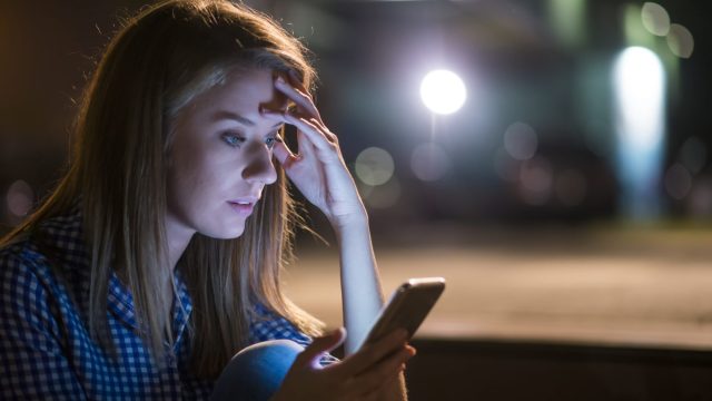 young woman got bad news with her smart phone