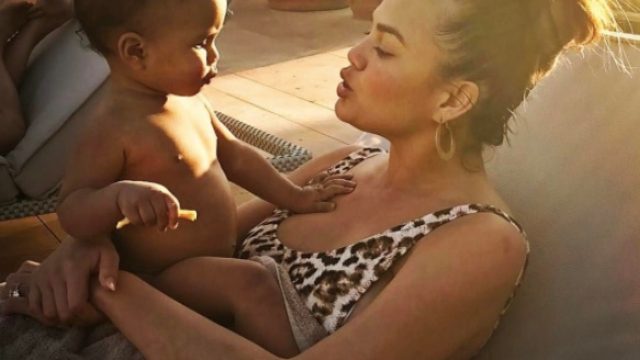Chrissy Teigen and baby Luna smile at each other