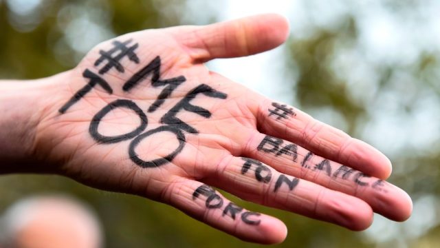A picture shows the messages "#Me too" and #Balancetonporc ("expose your pig") on the hand of a protester during a gathering against gender-based and sexual violence called by the Effronte-e-s Collective, on the Place de la Republique square in Paris on October 29, 2017. #MeToo hashtag, is the campaign encouraging women to denounce experiences of sexual abuse that has swept across social media in the wake of the wave of allegations targeting Hollywood producer Harvey Weinstein.