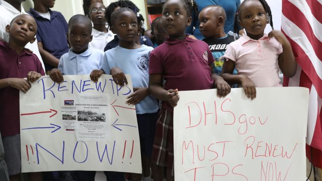 MIAMI, FL - NOVEMBER 06: Children hold posters asking the Federal government to renew Temporary Protected Status during a press conference about TPS for people from Haiti, Honduras, Nicaragua and El Salvador at the office of the Haitian Women of Miami in the Little Haiti neighborhood on November 6, 2017 in Miami, Florida. The U.S. Department of Homeland Security is nearing a decision on the plans for TPS recipients. Last week Secretary of State Rex Tillerson sent a letter to DHS possibly signaling a decision to remove the immigrants' protected status, telling them that conditions in Central America and Haiti no longer required them to be exempted from deportation. (Photo by Joe Raedle/Getty Images)