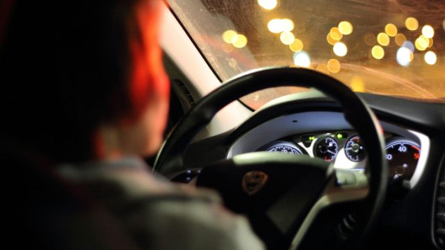 woman driving at night