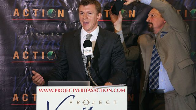 WASHINGTON, DC - SEPTEMBER 01: Conservative undercover journalist James O'Keefe (L) is photographed by Project Veritas Action Senior Communications Strategist Stephen Gordon during a news conference at the National Press Club September 1, 2015 in Washington, DC. O'Keefe released a video of that accuses the Democratic frontrunner Hillary Clinton's director of marketing and FEC compliance director of breaking the law by allowing a Canadian tourist to buy $75 of campaign swag using the Project Veritas Action journalist as a straw purchaser. O'Keefe promised that people will resign from their jobs as his "Army of Exposers" record and release more undercover videos during the 2016 campaign. (Photo by Chip Somodevilla/Getty Images)