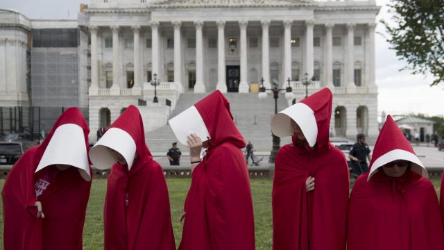 Picture of Planned Parenthood Supporters Dressed as Handmaids Protesting Outside the US Capitol