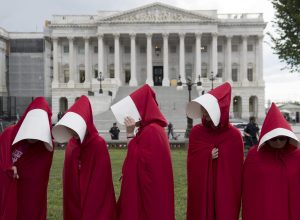 Picture of Planned Parenthood Supporters Dressed as Handmaids Protesting Outside the US Capitol