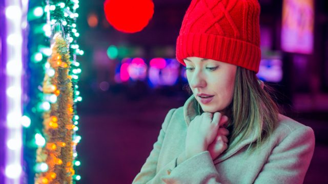Woman near Christmas tree