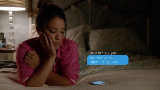 Jane from Jane the Virgin looking at text message