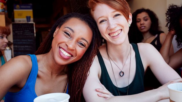 Smiling women in coffee shop