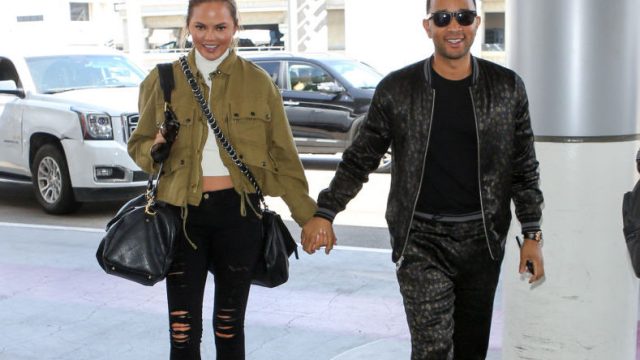 LOS ANGELES, CA - AUGUST 24: Chrissy Teigen and John Legend are seen at LAX on August 24, 2017 in Los Angeles, California.